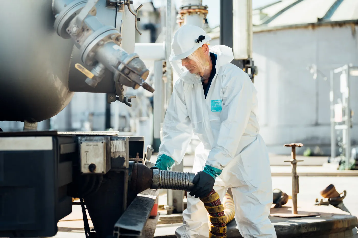Operator handling a waste stream connection